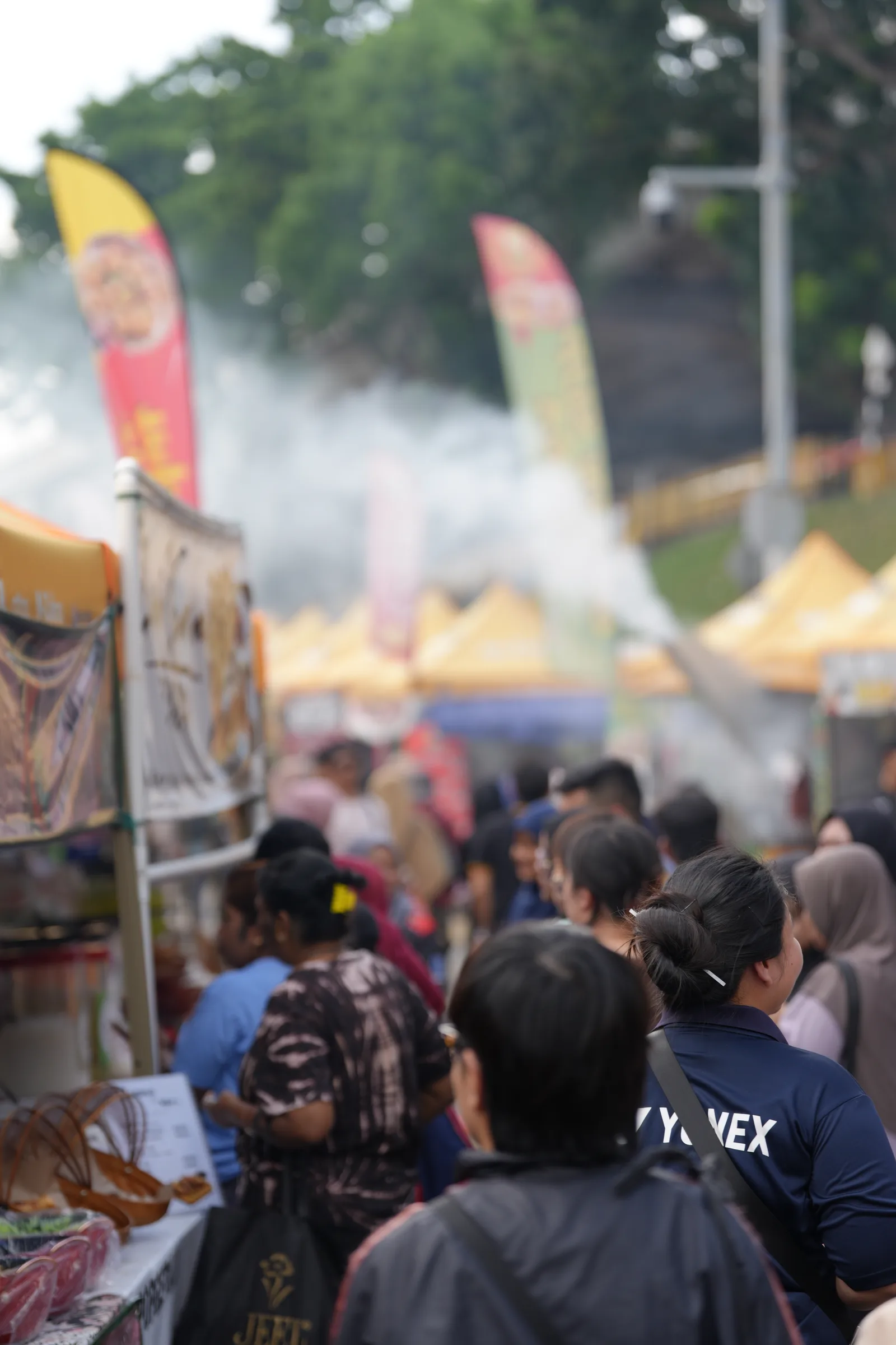 Smoke rising from cooking stalls — the bustle of a Ramadhan bazaar in KL