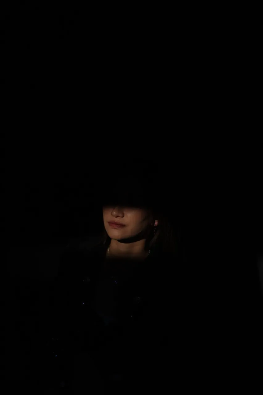 Chiaroscuro frame — the smallest possible pool of light