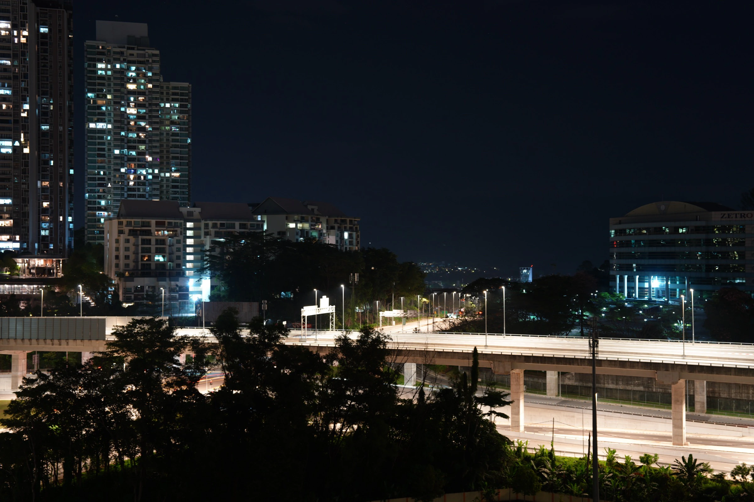 Kuala Lumpur night cityscape — residential towers and highway from above