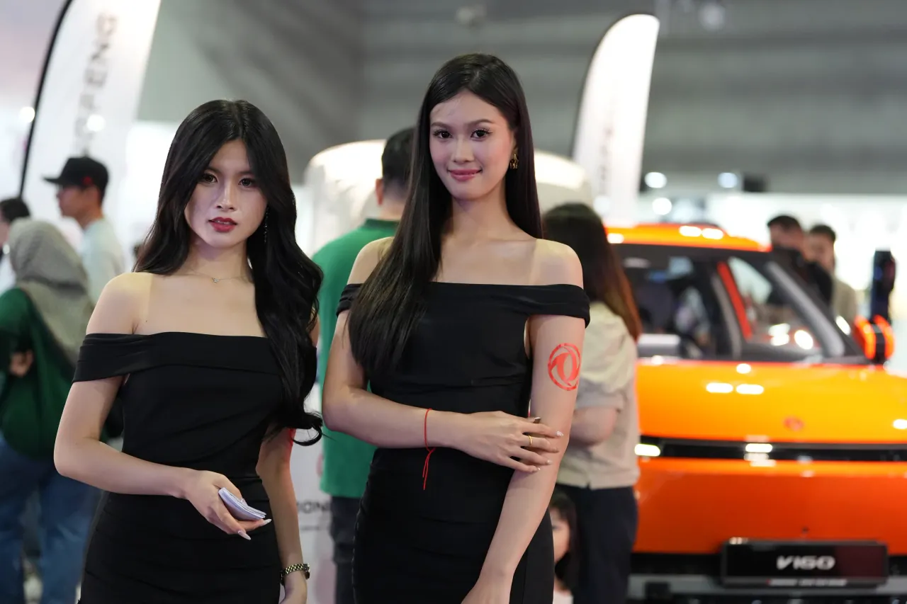 Paired brand ambassadors on a busy exhibition floor