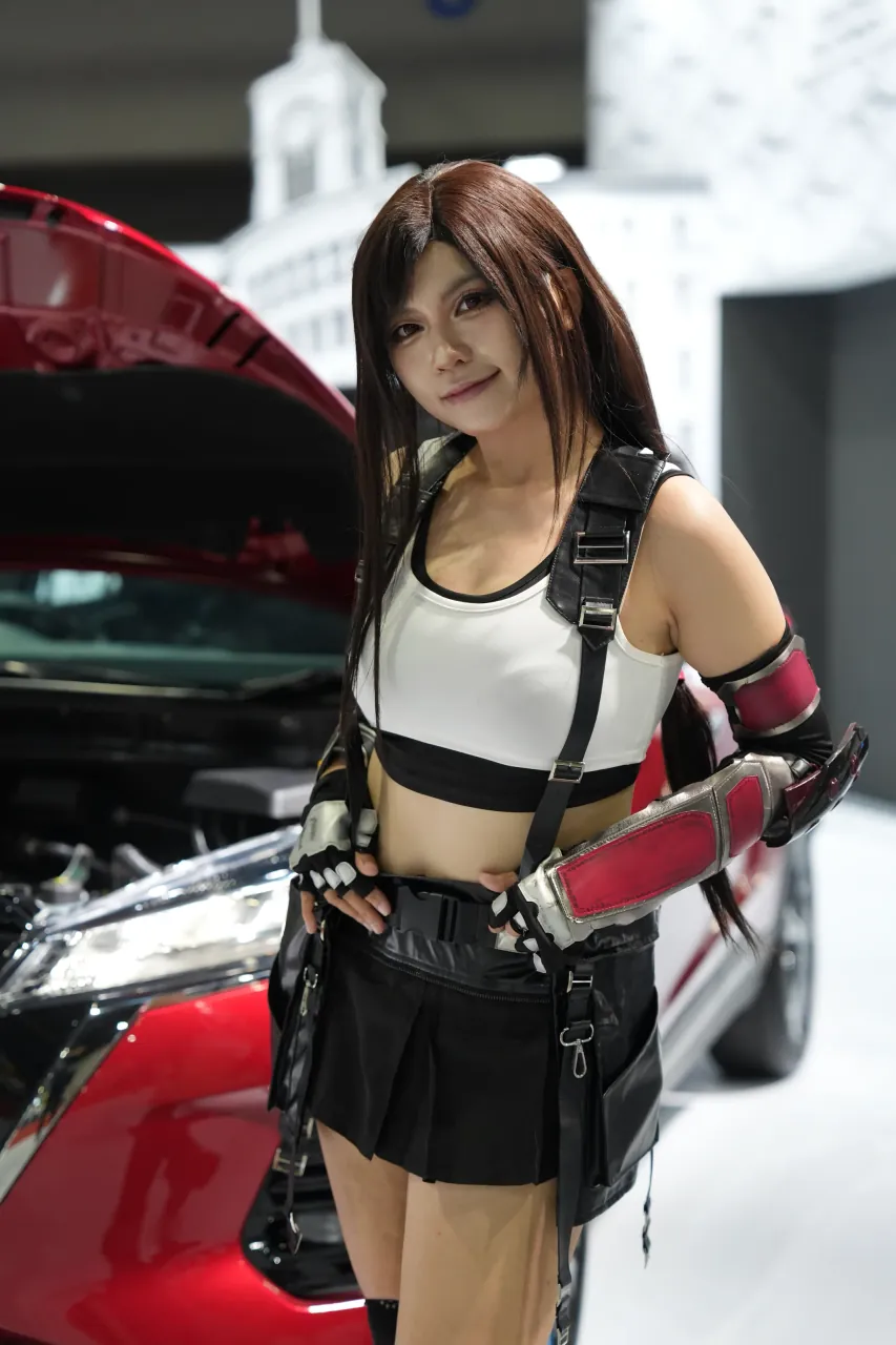 Costumed brand ambassador beside a display car