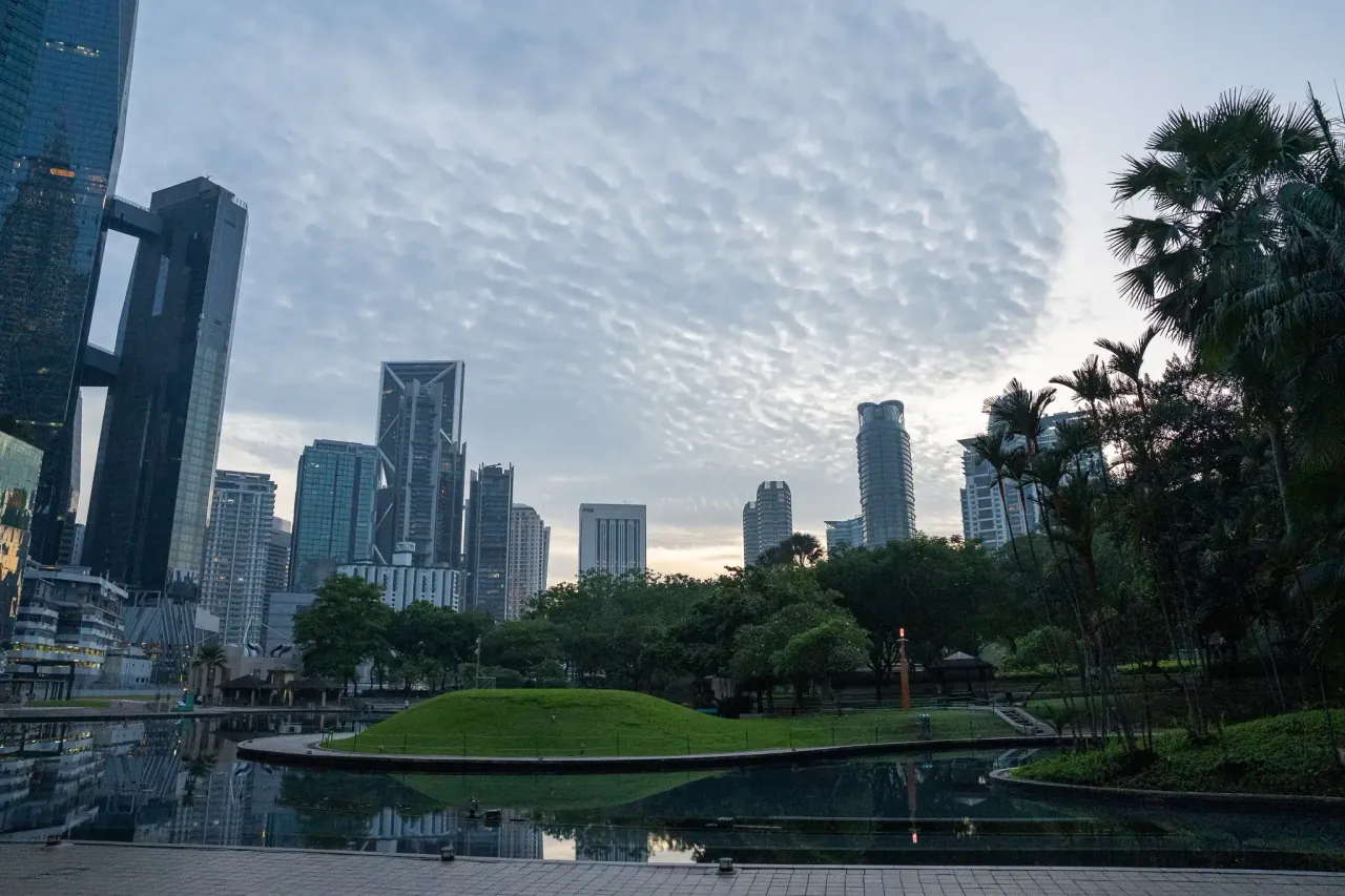 KLCC Park at dawn — golden hour skyline for tourism and travel content