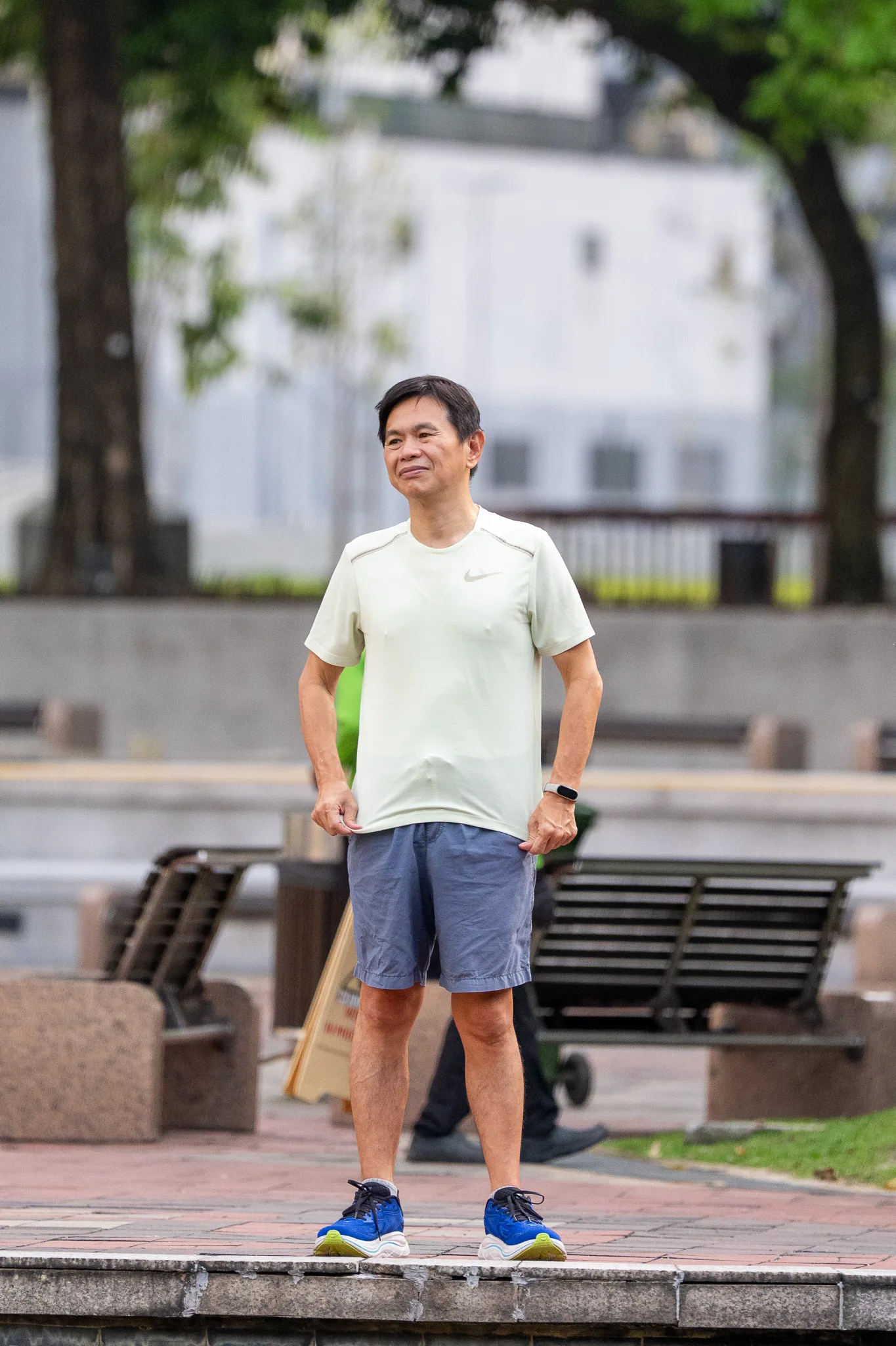 Early morning at KLCC Park — a local pauses before his walk