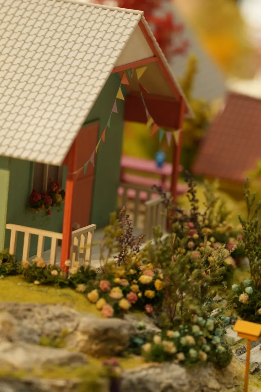 Cottage corner with flowering border in miniature