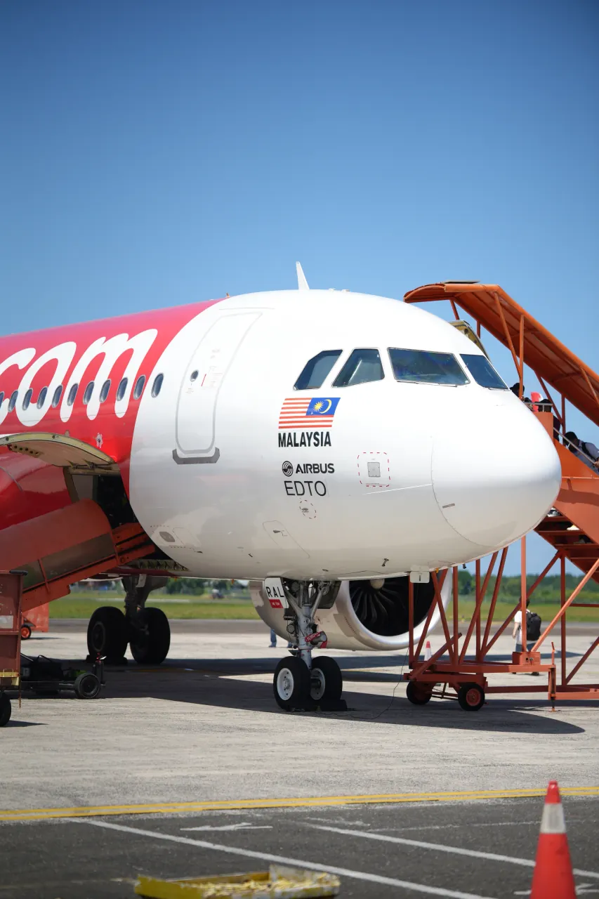 Cockpit detail — Malaysian flag and EDTO marking on the Sandakan tarmac
